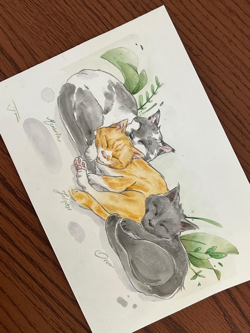 Fotografia de uma aquarela de duas pessoas com um cachorro e flores.